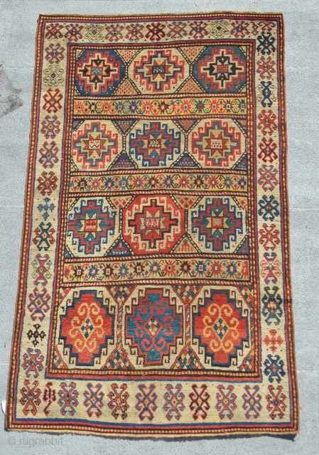 An early Moghan? Kazak. It has some very subtle repairs.

4'11" x 7'11"                     