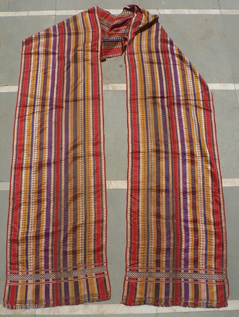 Old Indian Rajasthani Bridegroom’s Turban Length. Handloomed turban from Thar Desert region. 170 inches (14.5ft) x 21 inches. The textile has a red cotton foundation with colorful warp-face brocading to create the  ...