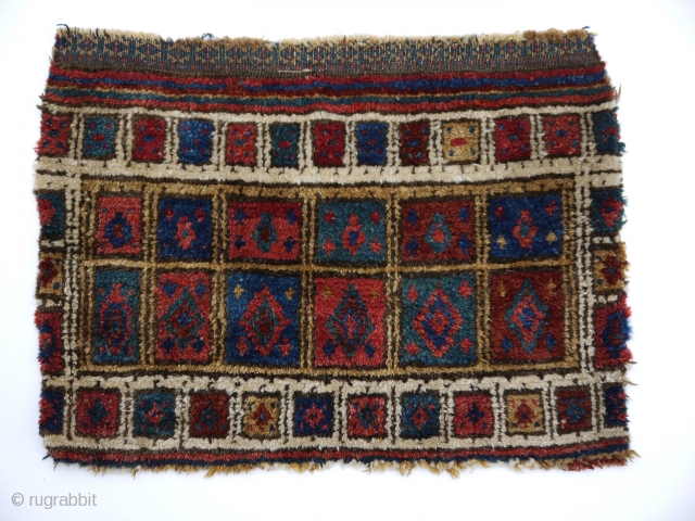 rare tribal bag face, Baluch  
deep natural colours, full pile, no repairs, a tribal conversation piece.  
64 x 48            