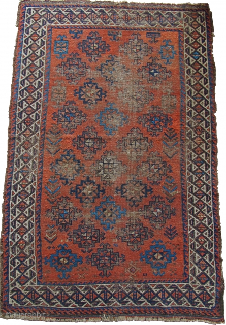 Baluch with stary field on an ochre ground. Looks like it should be symmetrically knotted but it is asymmetric open left. Beautiful spacing and placing of ornament. Traces of striped kilim on  ...