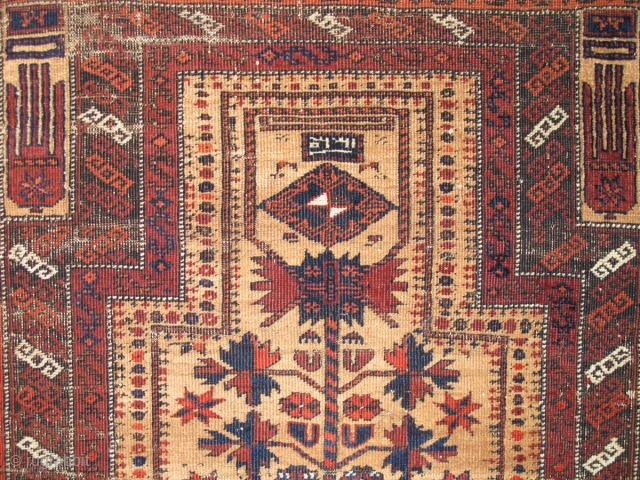 Crisply drawn Camel Ground Baluch Prayer Rug with elongated stylized hands, depressed warp Khorosan type. Dated Baluch prayer rug, a piece from Basha's Baluch Collection. 2'7"x4'7"
       