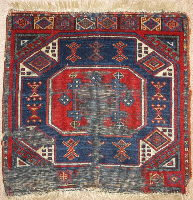East Anatolian rug fragment, very fine weave and saturated natural color. An exceptionally elegant but battered older example of an iconic type.           
