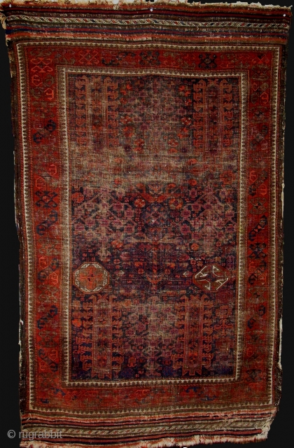 Antique Baluch rug or small main carpet (7'4"x4'6") from Khorosan, ne Persia. Timuri type shrubs and trees and unusual geometric elements. Worn but complete with natural colors including four blues, one corrosive,  ...