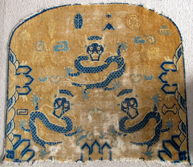 Large Chinese Ningxia Throne back with dragons, probably Kangxi period. About a meter wide. sides complete with weft returns, perhaps two inches missing from bottom, eccentric knotting, great drawing.    