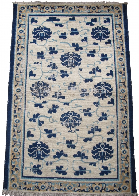 Sweet White-Ground Chinese Ningxia Rug, blue peonies and arabesque with a minimal border. hand-spun cotton warp and weft. very soft wool pile. size is 3'6"x5'7".        