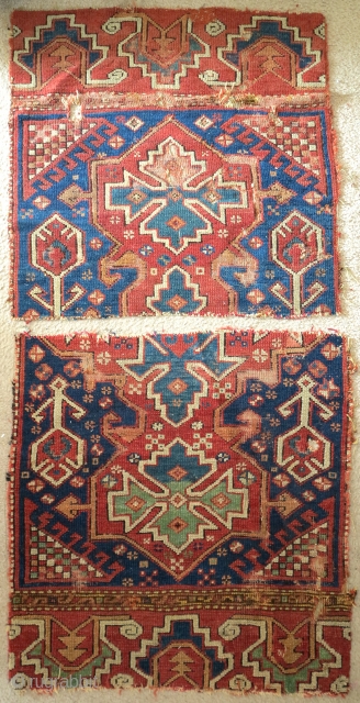 Two fragments of an exceptional 18th century blue-ground Bergama area rug with a curled tendril palmette border. Each approximately 2'6"x2'6".             