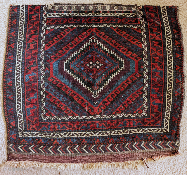 Baluch Sistan bag face with a Mushwani design. Full pile with sumak and kilim at the bottom end. Highlights in the center with an unusual light green/blue cotton? and cochineal. Former James  ...