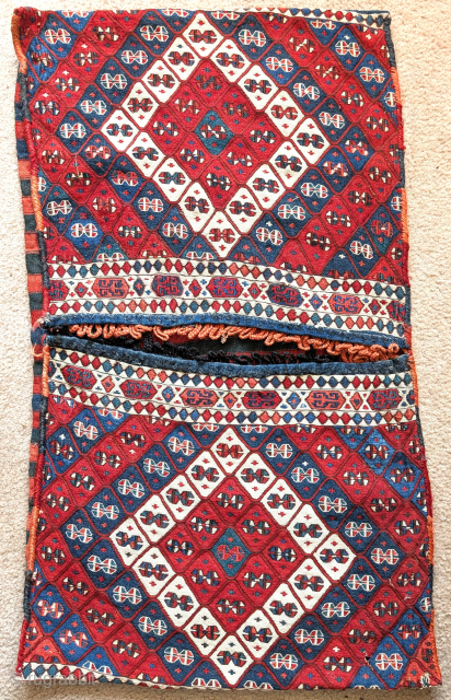 Complete East Anatolian weftless sumak saddle bag set. Fabulous natural color with vibrant madder red (no cochineal). Great age and in spectacular condition. Arguably, a 'best of type' example.    