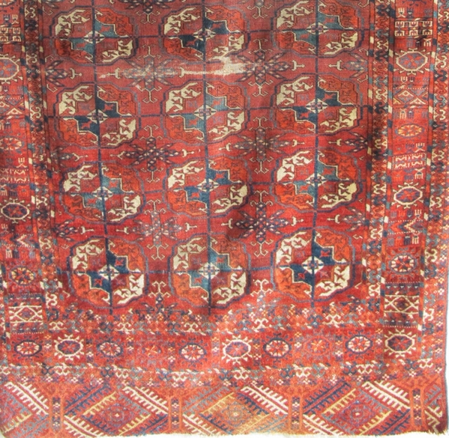 Tekke Long Rug, All colors are good, wool is soft and there are some silk highlights. Complete but with areas of wear and a stain at the very top. Older than most  ...