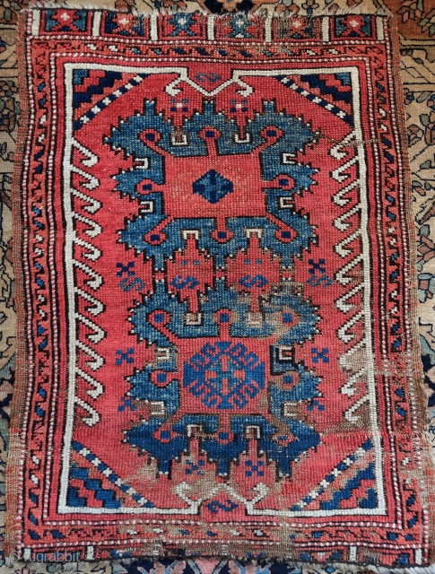 Konya yastik with a variant of a Holbein gul, front and back images. Condition is a little rough with some kashmiring of the oxidized dark brown as can be seen on the  ...