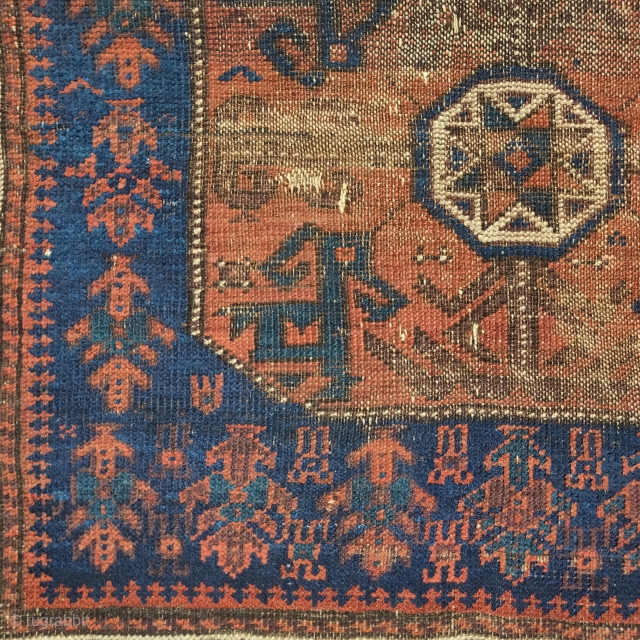 Baluch star bag with polychromatic blue, a blue-green and cinnamon ground. Looks older than most but worn.1 knot of cotton in lower right-center of field.        
