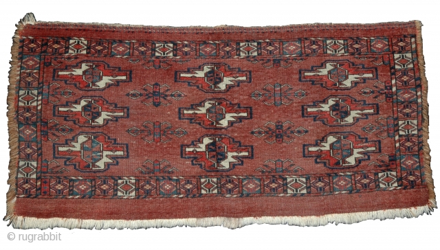 Yomut Turkmen Torba, well spaced smaller format piece with 3 rows of complementary but diversely drawn guls. Well weighted at the bottom. Symmetrically knotted, natural vegetal colors. 42"x20"     