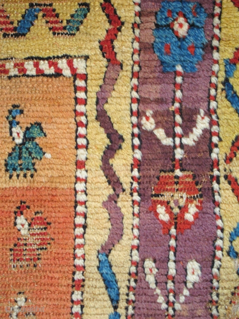 Vivid Saturated Color. Two matching fragments of an Anatolian Yatak, mounted together and conserved. multicolored carnations on a golden-saffron abrashed ground, perfect aubergine among the rainbow of colors.     