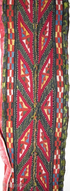 Tekke Turkmen embroidered band. Very fine. Very colorful with several blues, yellow, orange and insect red. Embroidered on a hand-woven green silk. 105x6cm          