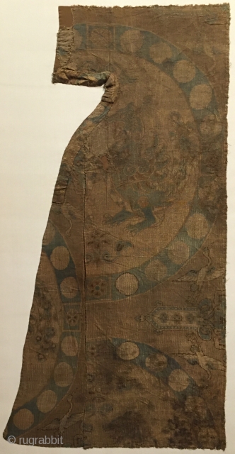 Tang Dynasty silk fragment with a large composite dragon in a pearl roundel. Central China, 8th century. An unusually rendered dragon perhaps based on Sasanian Persian or Sogdian prototypes?    