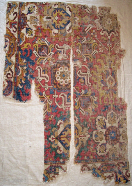 Caucasian Blossom Carpet Fragment, excellent drawing and colors, 17th/ early 18th century. This is the top left-hand corner of the carpet. It is photographed here upside-down. Mounted and conserved. 41"x61" / 104x163cm  ...