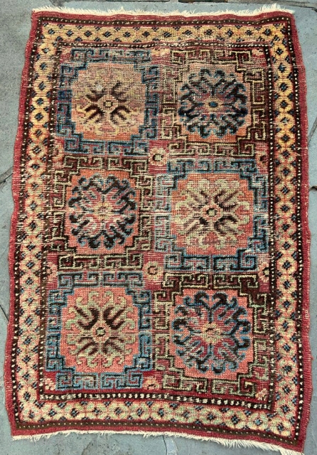 Small Khotan rug, good colors, areas of restoration                         