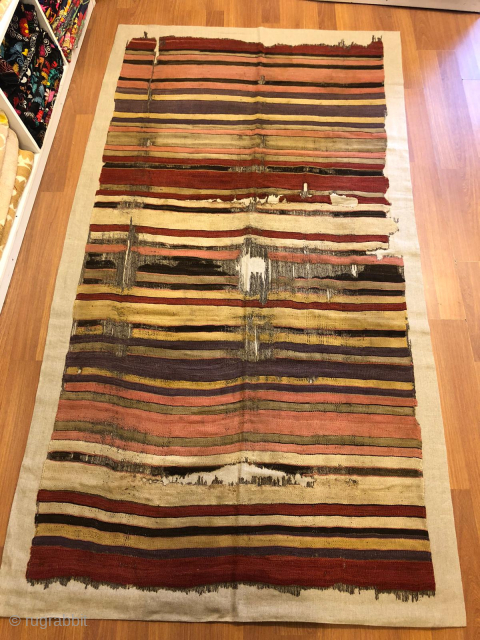 A stripe kilim around 1800, shows the early pinkish red, slighty damaged, all very good colors, available                