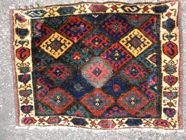 Jaf kurd bag face 2-2'-8" early and rare border. Heavy handle with lustrous wool and good dyes. Old repairs upper left and right corners. 
        