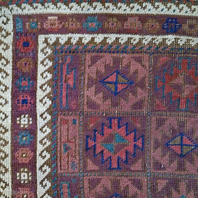 Baluch Rug. Unusual and very nicely balanced palette, with multiple shades each of blue, red and purple. 54" x 28". The design and the color would indicate an Aimaq origin. Evenly worn  ...