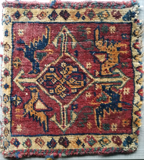 chanteh - squarish size measuring 10" x 11" and having cool winged birds in each quadrant.  Has what looks like ink stain on back.        