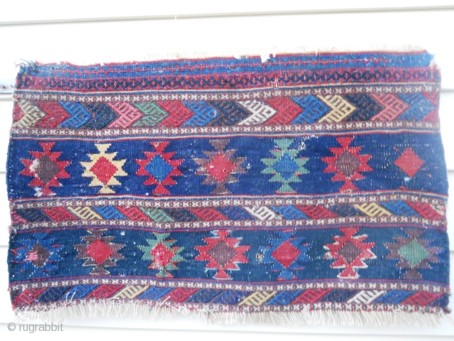 Kilim panel as found condition with some small holes.  Saturated color and design.                   