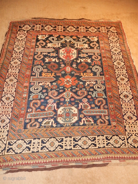 SUPERBLY DESIGNED AND LARGE 55 X 66 INCH KUBA RUG WITH EXCELLENT GLOWING PILE - COMPLETE ORIGINAL  BRAIDED ENDS - WONDERFUL ANIMALS WOVEN HERE AND THERE - 
SEWN TEAR ON THE  ...