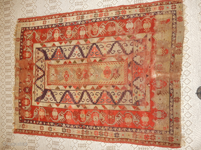 OLD MELAS RUG WITH WEAR AND OUTSTANDING ABERGINE OR PURPLE DYE USED 
BOYLSTON ASSOCIATES ANTIQUE CAUCASIAN RUGS .COM               