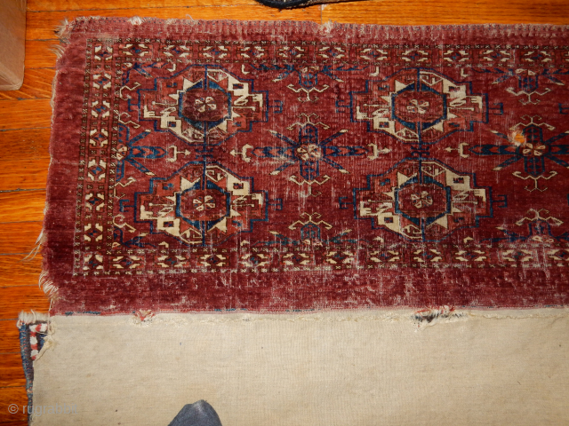 BOYLSTON ASSOCIATES ANTIQUE CAUCASIAN RUGS .COM 
TEKKE TORBA CIRCA 1870 DECENT PILE WITH SOME WEAR BUT WITH THE COMLETE BACK 
TWO HORNS ON EACH ANIMAL HEAD , NICE OLDEST INDIGO DYE USED
MAYBE  ...