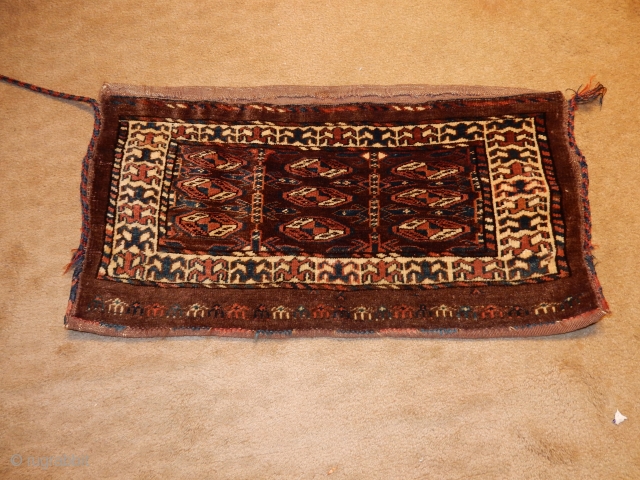 SMALL YOMUT YOMUD MAFRASH WITH FULL PILE- ALL NATURAL DYES - A CARAVAN OF CAMELS ACROSS THE BOTTOM AND THE ORIGIAL BACK STILL ATTACHED . PRICED AT $33 PER CAMEL - $775. 