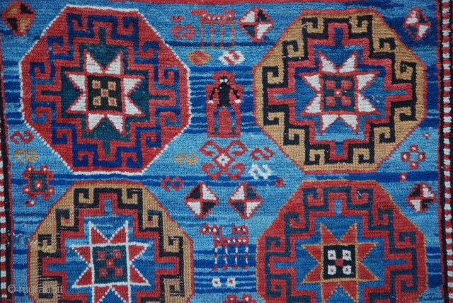 This stunning 19th century Moghan rug has a wonderful abrash of indigo-blue with the gols appearing to 'float' on the surface! The overall pile is evenly low but in good condition. 1.93m  ...