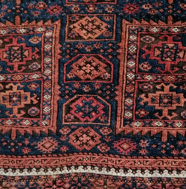 A fine antique truly tribal Timuri Baluch rug with an unusual central axis of small mihrab-like motifs, early 20th c. Well preserved and for a nice price.      