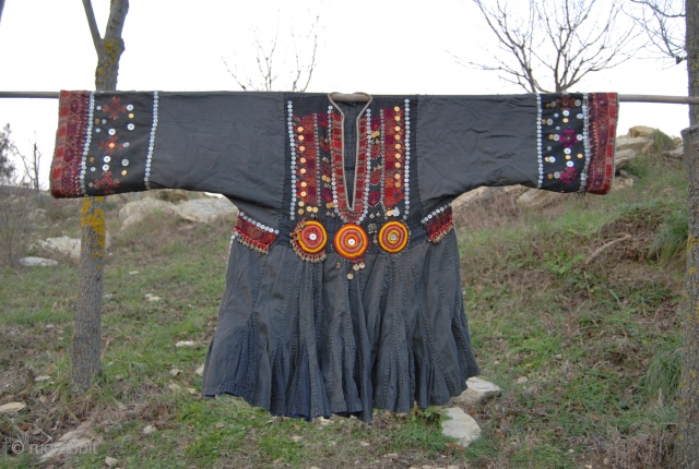 Nuristan. Jumlo or woman wedding dress from Kohistan/Nuristan, Northern Pakistan and Afghanistan. Heavily silk embroidered on black cotton, with lots of white and copper plastic buttons, metal roundels, lead beads, etc. Early  ...