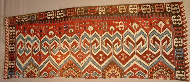 Aydin Kilim Strip.
Powerful & Beautiful Western Anatolia Aydinli kilim strip. 
Cm 100x265 ca. 3rd/4th q 19th century. 
Great ram horn pattern, glorious natural saturated colors. 
Condition: a few minor oxidations, two tiny  ...