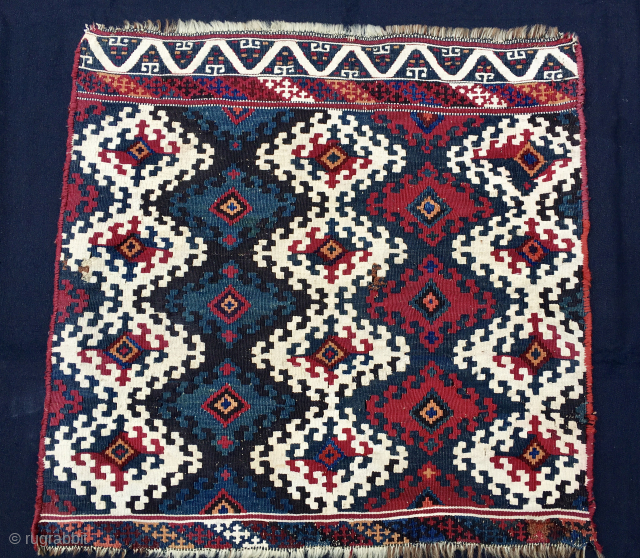 Sinanli tribal group 
Malatya area. Eastern Anatolia. Turkey. 
Big khorjin or saddle kilim bag face. Cm 73x73. 
End 19th/early 20th century. 
Highlights: great graphics, fantastic colors, a wonderful, deeply saturated cochineal, a  ...