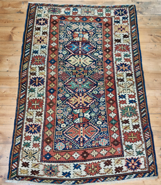 Caucasian small and rich pile rug from the Ghendje area, Azerbaijan.
The size is cm 95x145. 
Age is credited as end of 19th century or slightly earlier.
This small rug is very rich in  ...