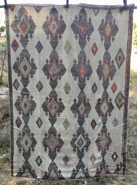 Central Anatolia, Sivas area cicim. Cm 140x205. 1st half 20th century. Cord color back with embroidered pattern filled with kind of Sevan crosses. A couple of small holes, otherwise in good condition.  ...