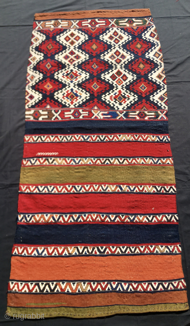 Sinanli tribal group. 
Malatya area. Eastern Anatolia. Turkey. 
Big khorjin or saddle kilim bag. 
Cm 74x158. End 19th/early 20th century. 
Highlights: great graphics, fantastic colors, a wonderful, deeply saturated cochineal, a sweet,  ...