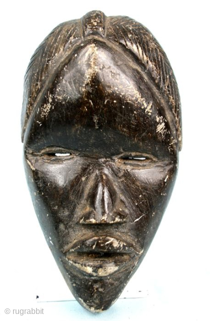 African Art.
Dan mask, carved in stone.
The mask has a shape of a "runner mask", but such items are sacred and not dedicated to run.
Item of great quality, for collectors
Height: 20 x 11,5  ...