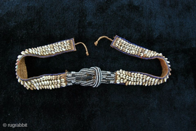 Africa! Congo.
Kuba people belt. Raffia, cowry shells, glass beads. 
Kuba people belt (mukody mu-ikup lakiing). 
Democratic Republic of Congo. 
First half 20th century. 
A wonderful tribal art example made of raffia, cowry  ...