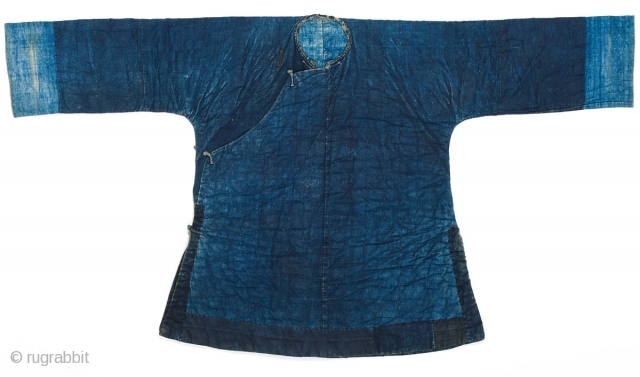 An indigo padded winter jacket for daily use, from Guangxi province, Southwestern China. Cotton, with cotton padding. 19th Century. 134cm x 73cm.

This is a Miao minority jacket, however it is essentially the  ...