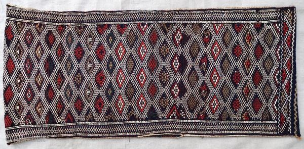 Authentic kilim cushion from the Moroccan Middle Atlas, circa 1950.

Origin : Morocco
Period : around 1950
Size : 87 x 38 cm
Material : wool and cotton
Good general condition
Handwoven

✦ Price and photos on www.christiandoux.com/products/moroccan-pillow-87-38  