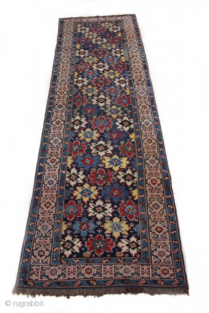 A classic Shirvan "field of flowers" runner with rebound sides and a few small areas of reweaving with original macrame ends. Kufic border. Dated 1844. 105 x 344 cm ( 3'5" x  ...