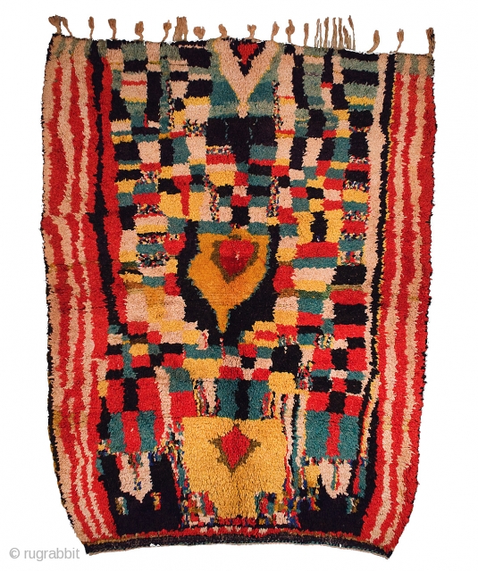A good vintage Berber Zenaga rug from the southern Jebel Siroua region in the High Atlas of Morocco. This rug features an enigmatic diamond shaped mirhab surrounded by whimsical checker-board patterns. Hand  ...