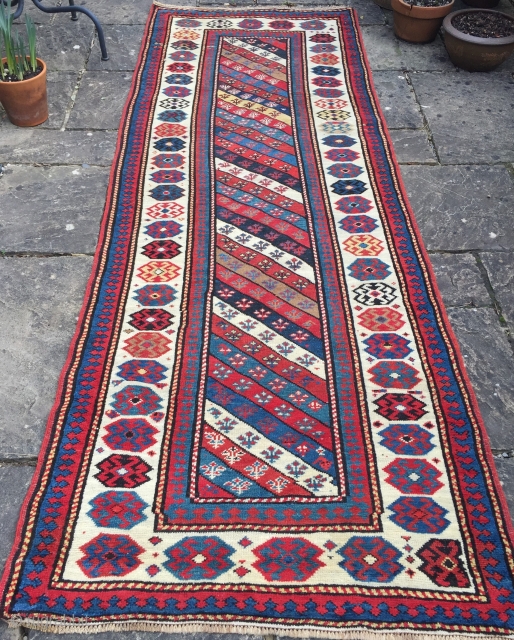 Antique Caucasian Gendje Kazak runner with diagonal stripe design. www.knightsantiques.co.uk

Size: 9ft 5in x 3ft 4in (287 x 101cm). 
Circa 1880.

A good example with excellent colour and a striking ivory ground border. The  ...