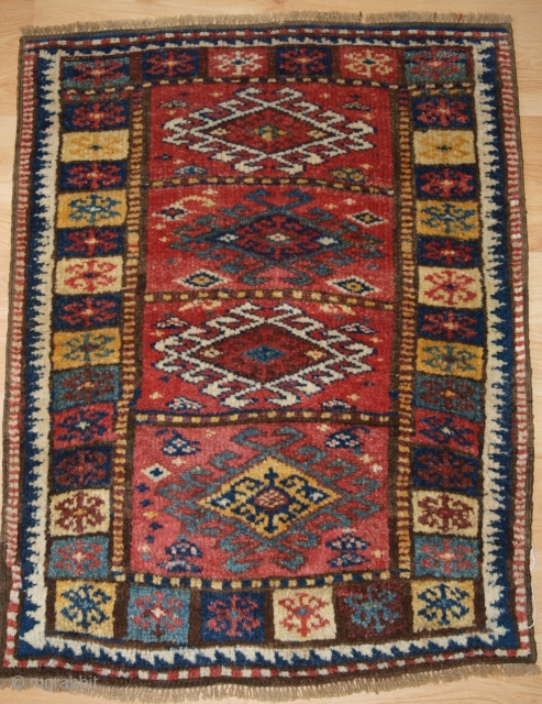 Antique North West Persian Kurdish yastik with excellent colour and traditional design. www.knightsantiques.co.uk Size: 2ft 11in x 2ft 3in (90 x 69cm). 

Circa 1900.

Yastik are small piled rugs that were used as  ...