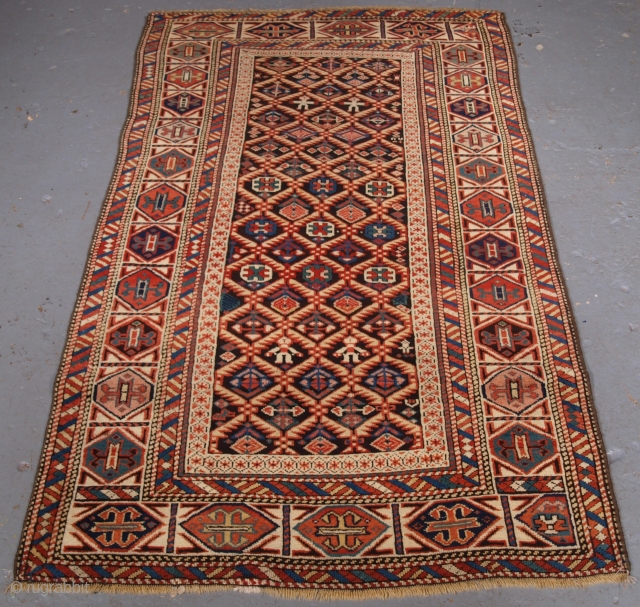 Size: 5ft 7in x 3ft 3in (171 x 98cm). Click the link www.knightsantiques.co.uk to view more items.

Antique Caucasian Dagestan rug with lattice design on a dark charcoal ground. 

Circa 1880.

A very good  ...