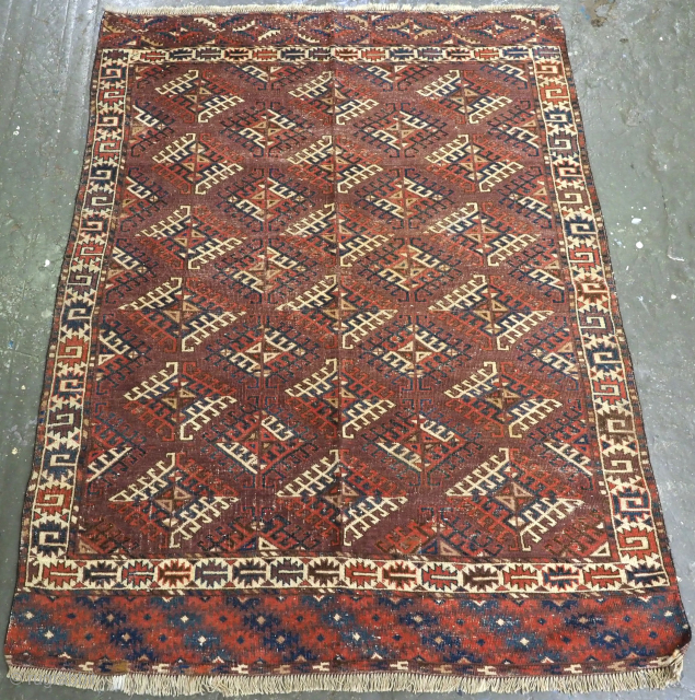 Size: 6ft 6in x 4ft 9in (197 x 146cm).

Antique Yomut Turkmen rug with Darnyk gul design to the field.

Circa 1870 or earlier.

The rug has a warm aubergine coloured field decorated with rows  ...