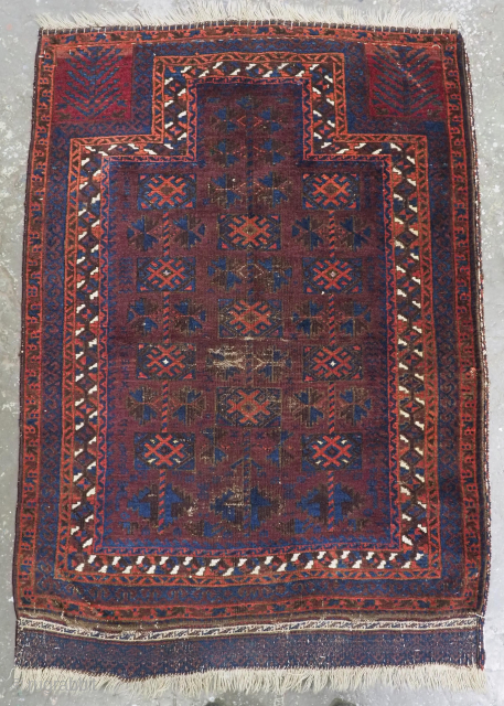 Size: 4ft 0in x 2ft 10in (122 x 87cm).

Antique Baluch prayer rug by the Yaqoub Khani sub tribe of the Timuri, with box design on a scarce aubergine coloured ground.

Circa 1880 or  ...