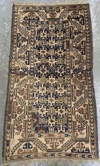 Size: 4ft 9in x 2ft 8in (145 x 82cm).

Antique Khorasan region Baluch rug with a lattice design woven with camel wool.

Circa 1900.

This tribal Baluch rug is of a very rustic form, woven  ...